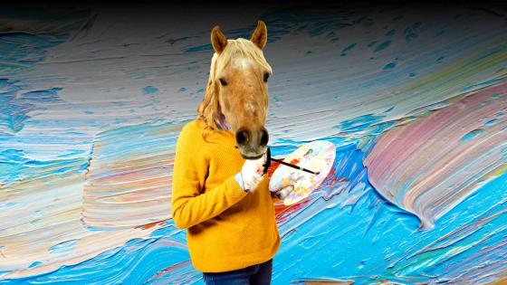 A person with a horse's head holding a paintbrush and paint