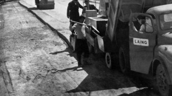 Workers laying concrete base for M1