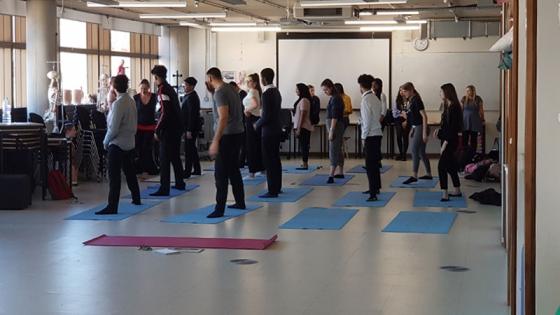 Students on exercise mats: The Yoga Experience