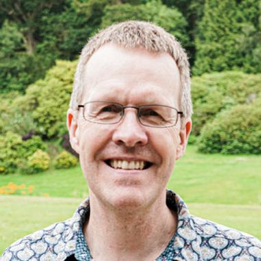 Headshot of Professor Graham Smith with natural background