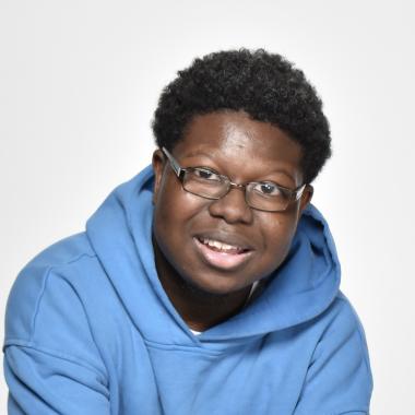 Head and shoulders image of Michael Folarin